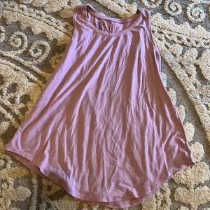 I don’t remember the brand but it is a nice shirt! Color is dessert rose